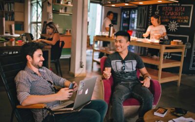 Two men sitting in a start up company office