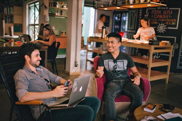 Two men sitting in a start up company office