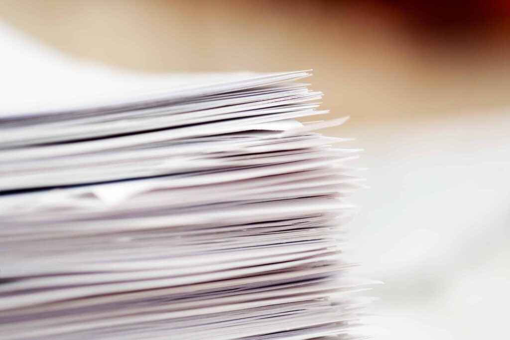 Close up of a stack of white papers