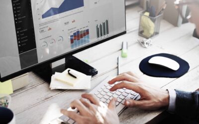 Man sitting at computer review the analytics from his website