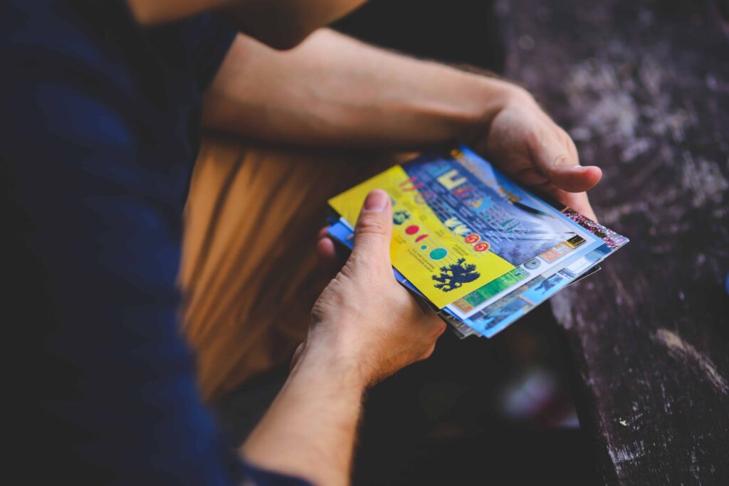 Man holding postcards