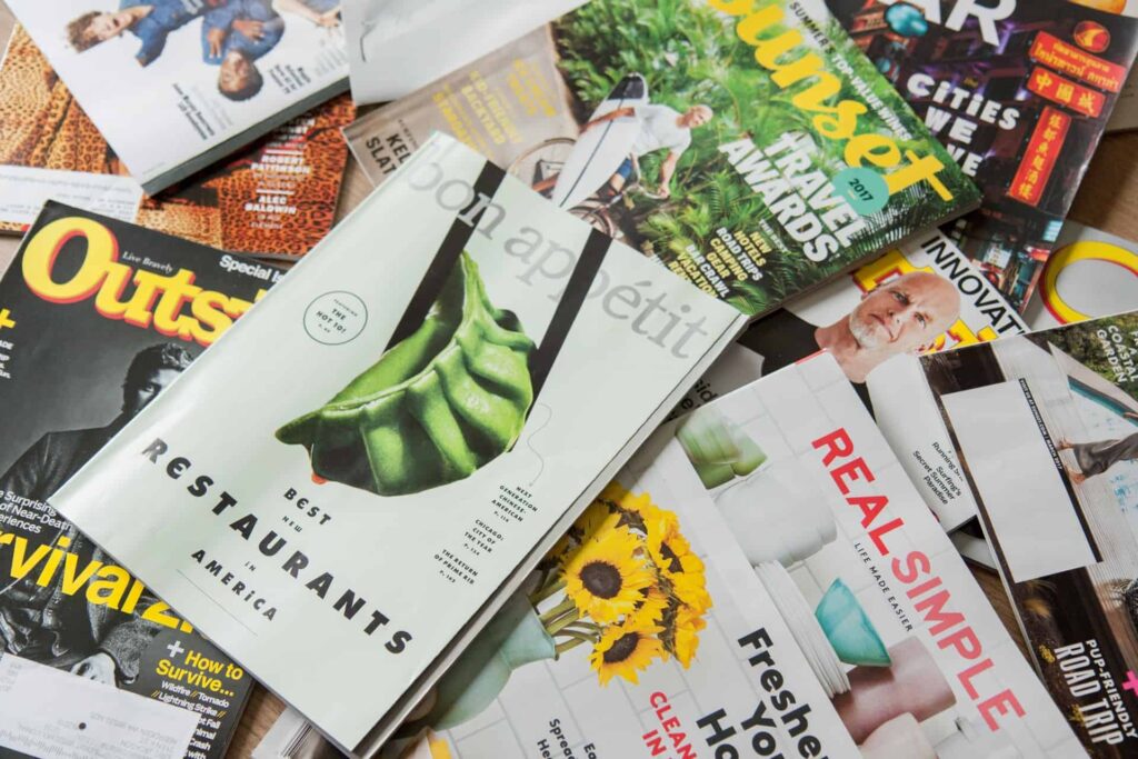 Stack of magazines, mostly perfect bound books