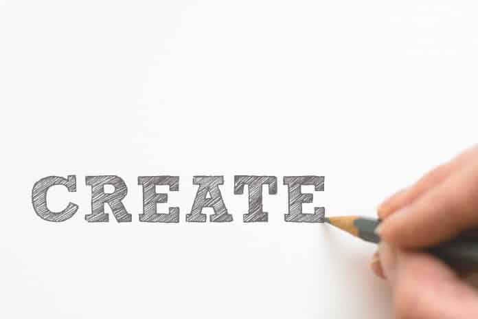 Hand writing the word create