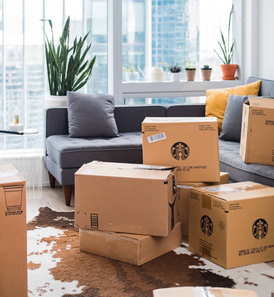 Branded shipping boxes in front of a couch