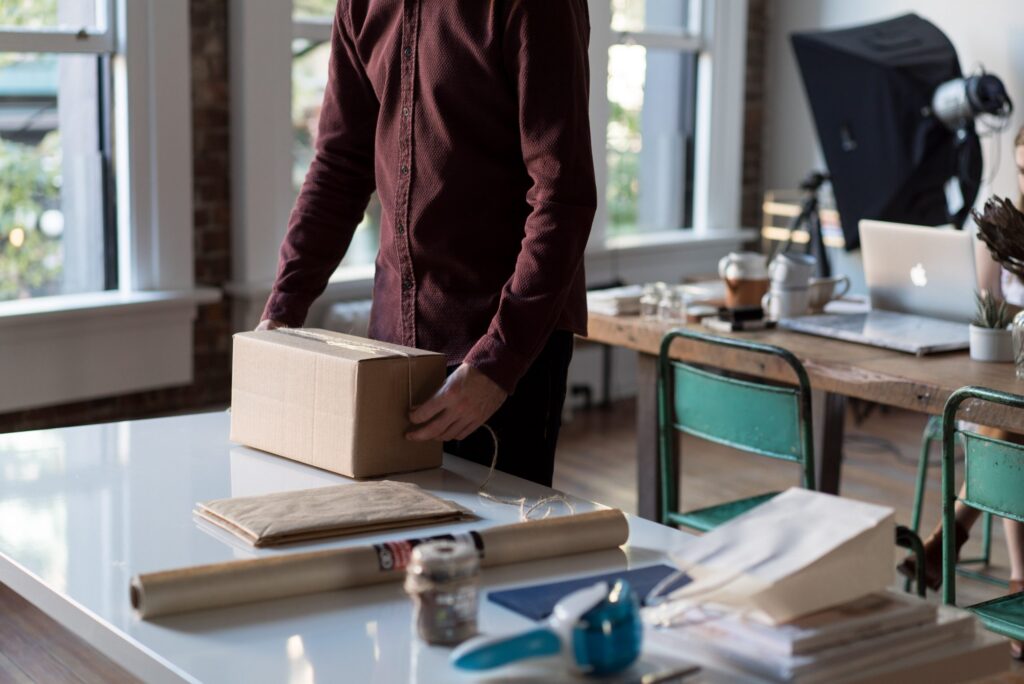 person closing a package