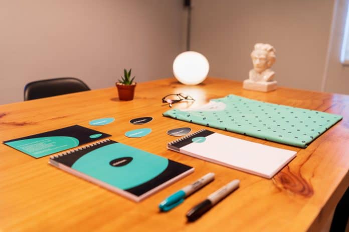 Matching branded print products organized on a table