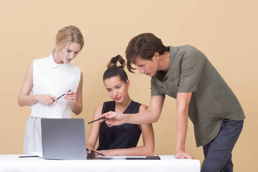 People collaborating over a laptop