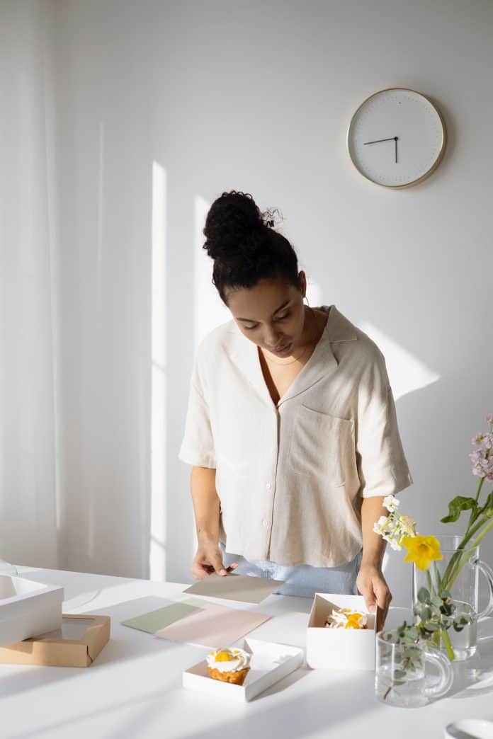 A Woman Standing at the Table