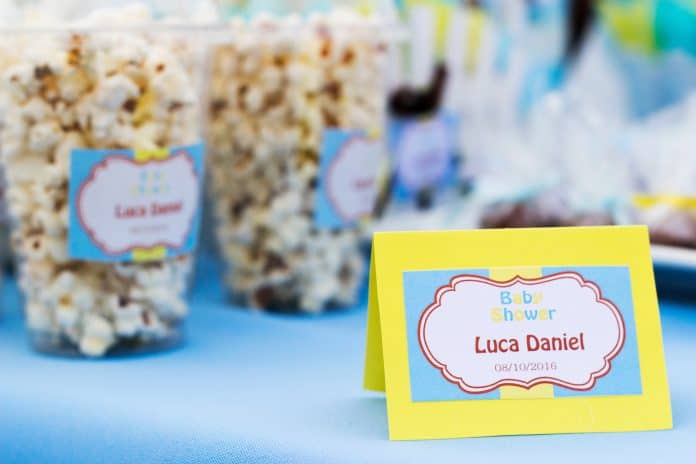 baby shower name and popcorn in a cup