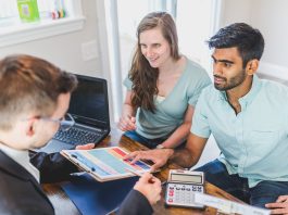 Couple sitting own with a realtor